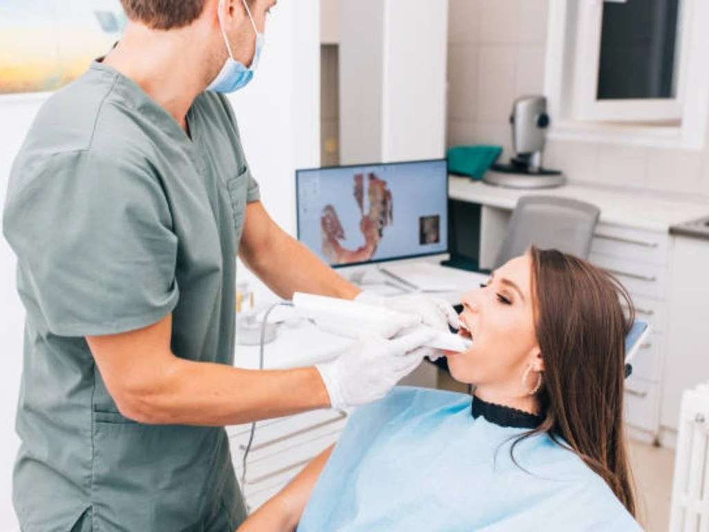 A dentist using the modern dental tools and equipements to provide treatment to a patient showcasing advanced dental care