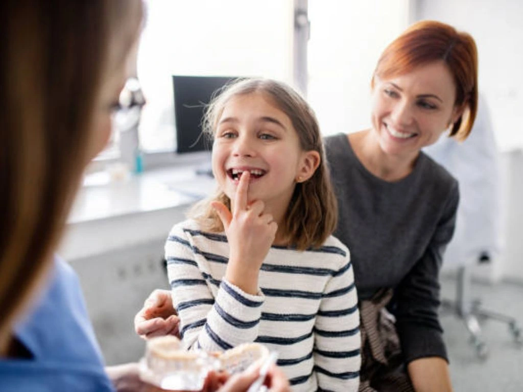 Dentist performing a dental check up on a young child